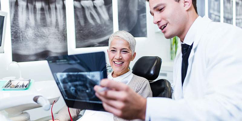 Lady being shown her teeth in xray