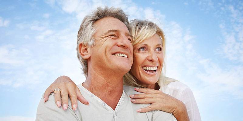 Lady holding her man smiling